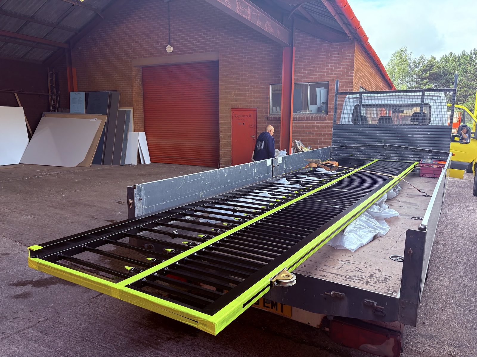 A finished gate frame loaded outside the workshop