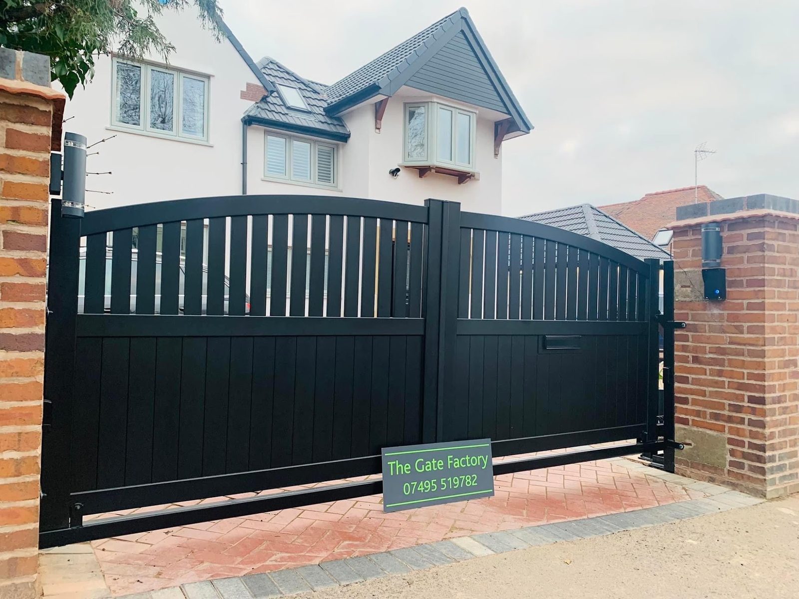 Gates and railings matched across a frontage