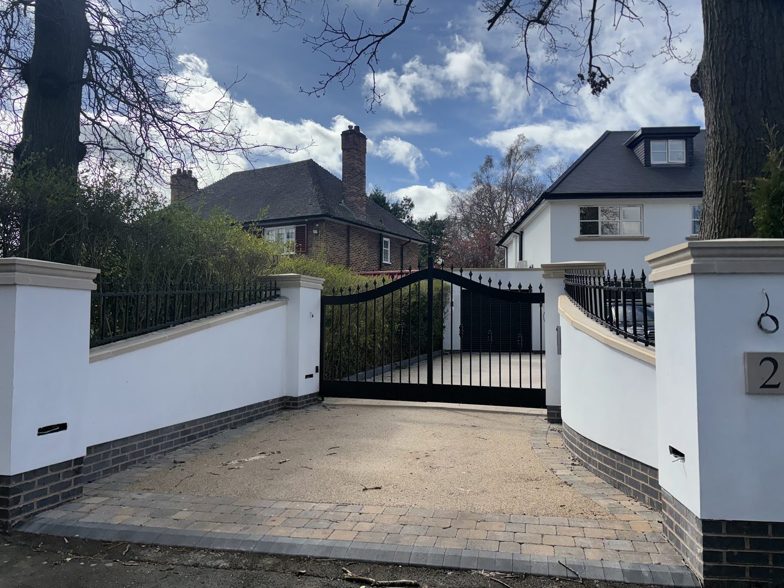 Bar gates set between rendered piers